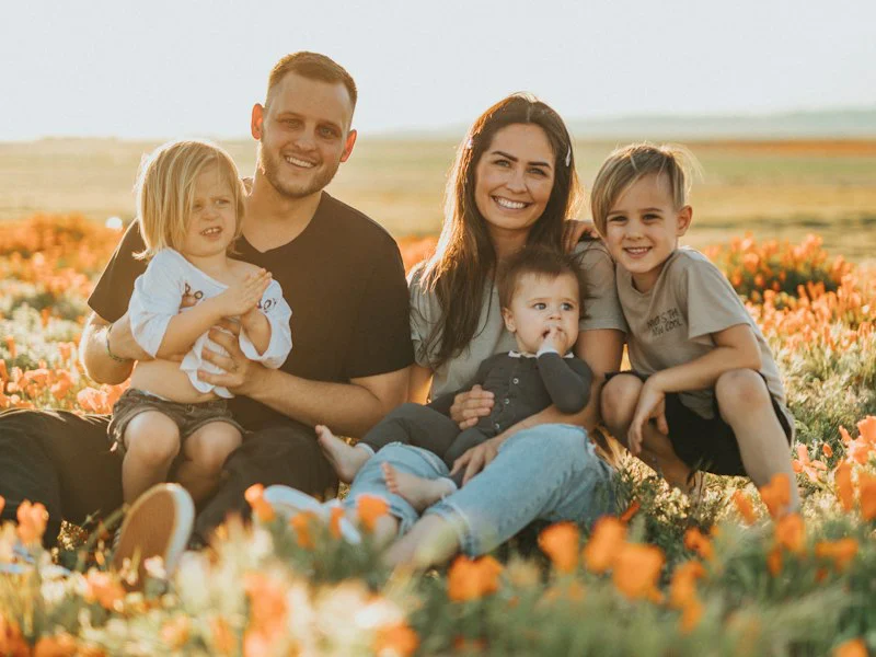 Smiling family gathered outdoors